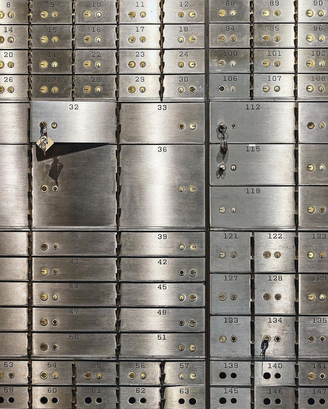 Secure bank deposit boxes representing asset management.